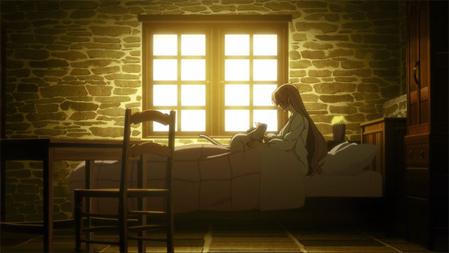 woman lying in bed looking at cat.